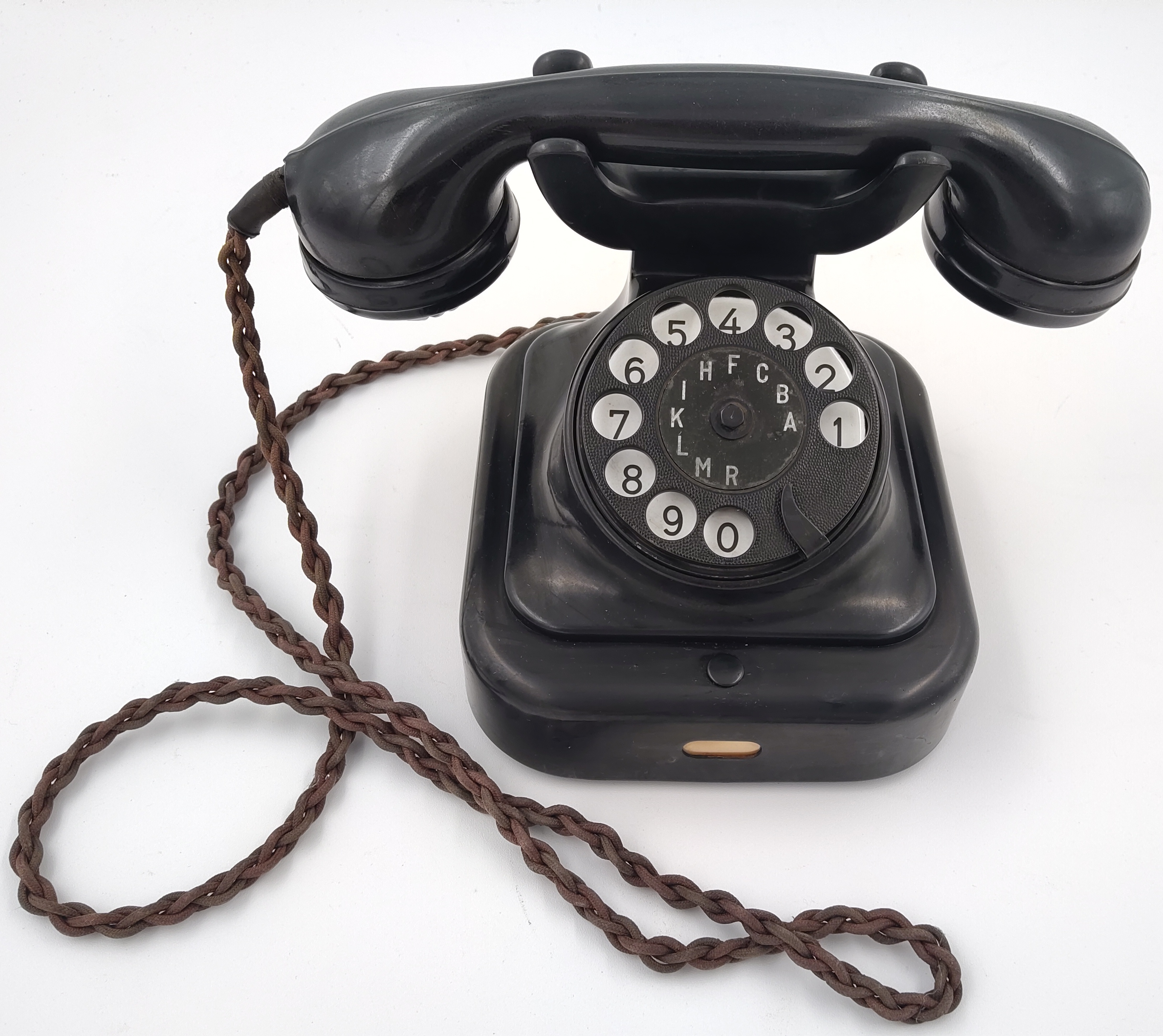 Starožitný bakelitový telefon se sluchátkem – 30 až 50. léta